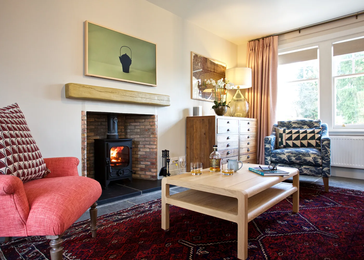 Sitting room at Ross Lodge with wood-burning stove